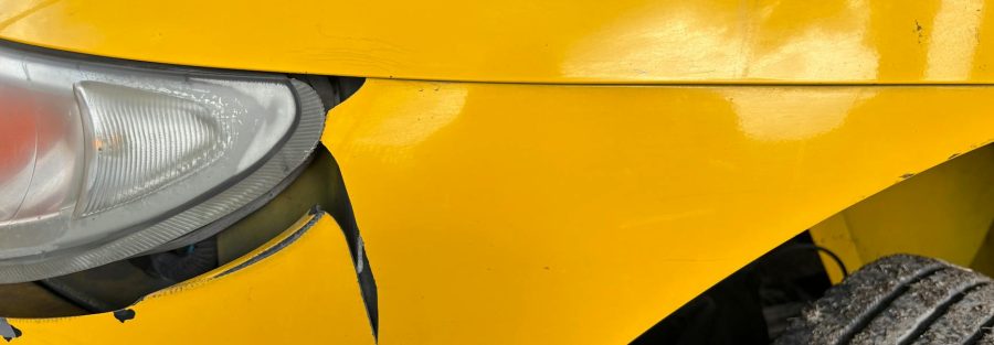 Illustration: commercial vehicle with safety features and a driver, representing insurance cost reduction strategies.