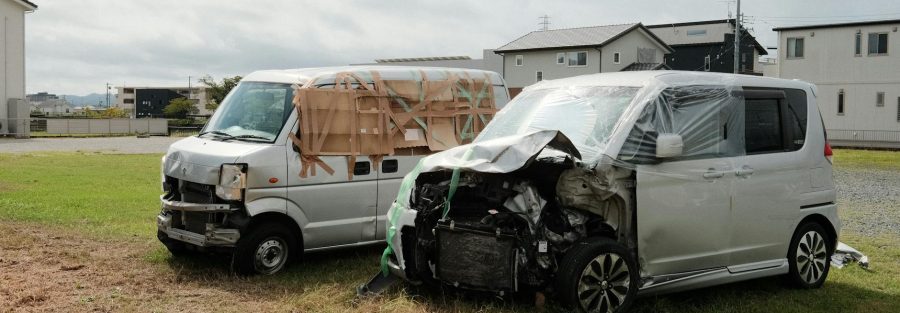 Illustration of a crashed commercial truck and car on a road with checklist items.